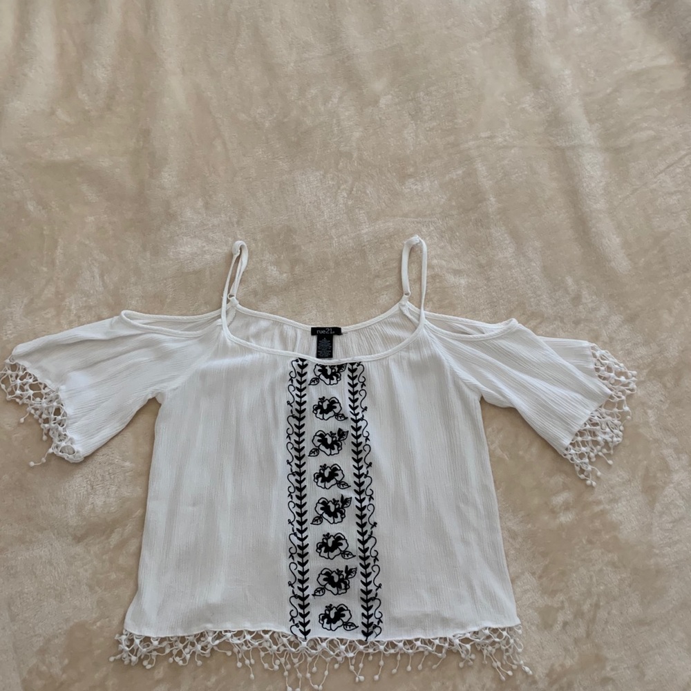 I am selling an adorable black and while blouse!
